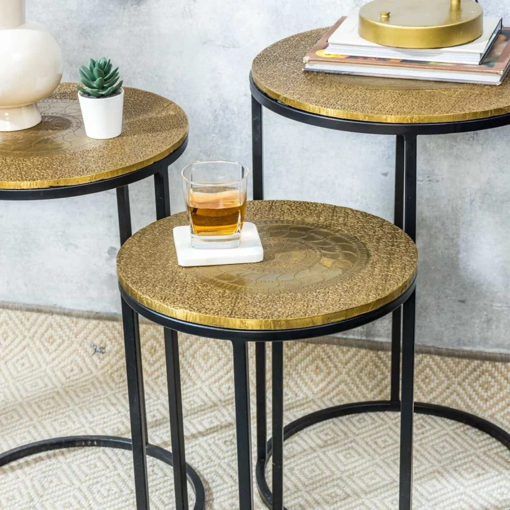 3 brass and black tables